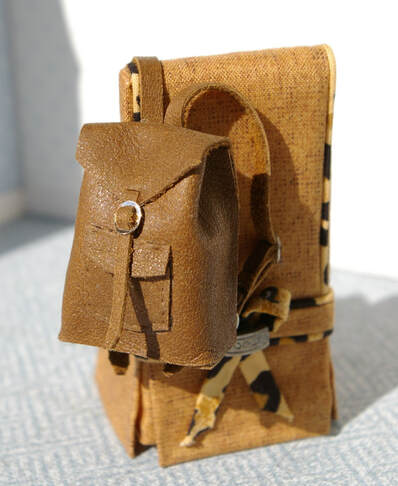 Miniature leather backpack
